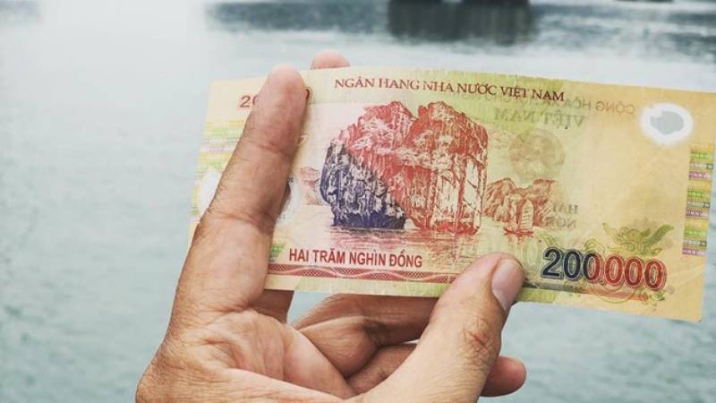 Điềm báo mơ thấy tiền 200 nghìn nếu nhặt được